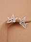 Sterling silver origami crane earrings poised delicately, capturing the spirit of Japanese art in a chic, wearable form.