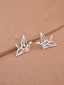 Sterling silver origami crane earrings poised delicately, capturing the spirit of Japanese art in a chic, wearable form.