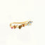 Gold-plated ear climbers with multi-colored pave stones, designed to ascend along the ear with a sunset-inspired gradient of vibrant hues