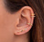 Gold-plated ear climbers with multi-colored pave stones, designed to ascend along the ear with a sunset-inspired gradient of vibrant hues