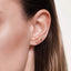 Gold-plated ear climbers with multi-colored pave stones, designed to ascend along the ear with a sunset-inspired gradient of vibrant hues