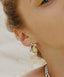 Elegant gold-plated pear-shaped earrings with diamond accents, evoking the lush beauty of a fruitful harvest.
