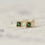 Chic petit emerald crystal studs with 14k yellow gold plating on sterling silver, perfect for adding a touch of elegance and trendy flair to any outfit.