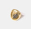 Gold and silver-toned statement ring with an abstract Picasso-inspired face design, a fusion of classic art and modern fashion.