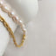 A stylish baroque pearl necklace with a golden chain accent, exuding a blend of classic beauty and modern sophistication.