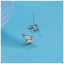 Tiny pterodactyl dragon stud earrings in sterling silver with 14k gold plating and cubic zirconia accents.