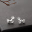 Delicate sakura sterling silver earrings featuring a cherry blossom flower branch design, 11mm x 7mm in size.