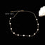 Chic petite pearls choker with a shimmering gold-filled chain, adjustable for a bespoke fit, embodies sophistication and timeless style.