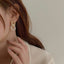 Elegant baroque pearl hoop earrings with real freshwater pearls and 14k gold plating.
