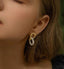 Elegant baroque pearl hoop earrings with real freshwater pearls and 14k gold plating.