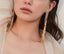 Rainbow curtain statement earrings with sterling silver posts, featuring vibrant rainbow colors and long, flowing chains.