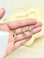 A gold necklace with a pinkie promise hand gesture pendant, embodying a timeless pledge and refined design.