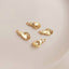 A gold necklace with a pinkie promise hand gesture pendant, embodying a timeless pledge and refined design.
