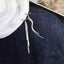 Elegant silver tassel dangle earrings, showcasing a blend of modern design and classic charm, ideal for fashion-forward individuals