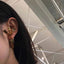 A set of gold vermeil earrings featuring elegant pineapples and carrots with intricate designs.