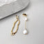 Modern abstract silhouette earrings with a lustrous pearl drop, combining artistic design with timeless pearl elegance.