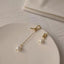 Subtle yet sophisticated minimalist pearl drop earrings with an elegant gold finish, perfect for any occasion.